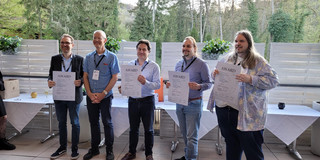 Authors holding their EATCS Best ETAPS Paper award certificates.