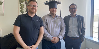 Fabian Brucker with Ben Hermann and Falk Howar after defending his doctoral dissertation